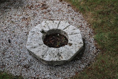 Lot 491 - An octagonal granite mill wheel