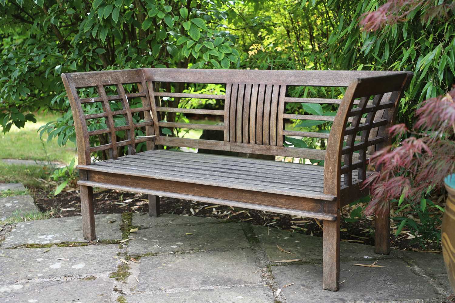 Lot 443 - A teak garden bench