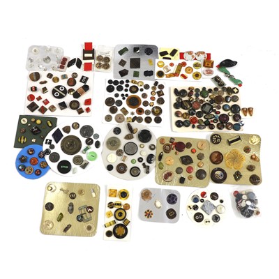 Lot 599 - A collection of celluloid, wood and horn buttons
