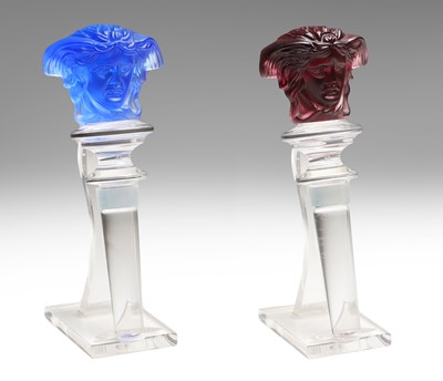 Lot 161 - A pair of Versace Medusa glass wine bottle stoppers