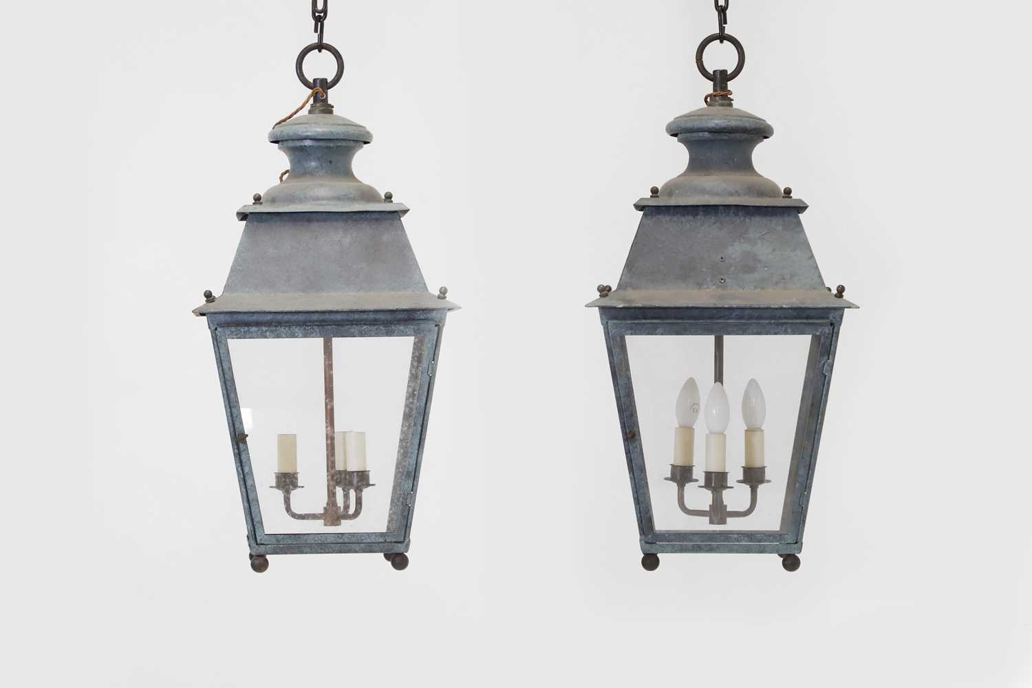 Lot 537 - A pair of patinated metal lanterns