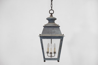 Lot 537 - A pair of patinated metal lanterns