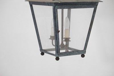 Lot 537 - A pair of patinated metal lanterns