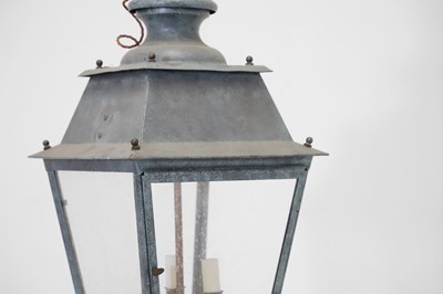 Lot 537 - A pair of patinated metal lanterns