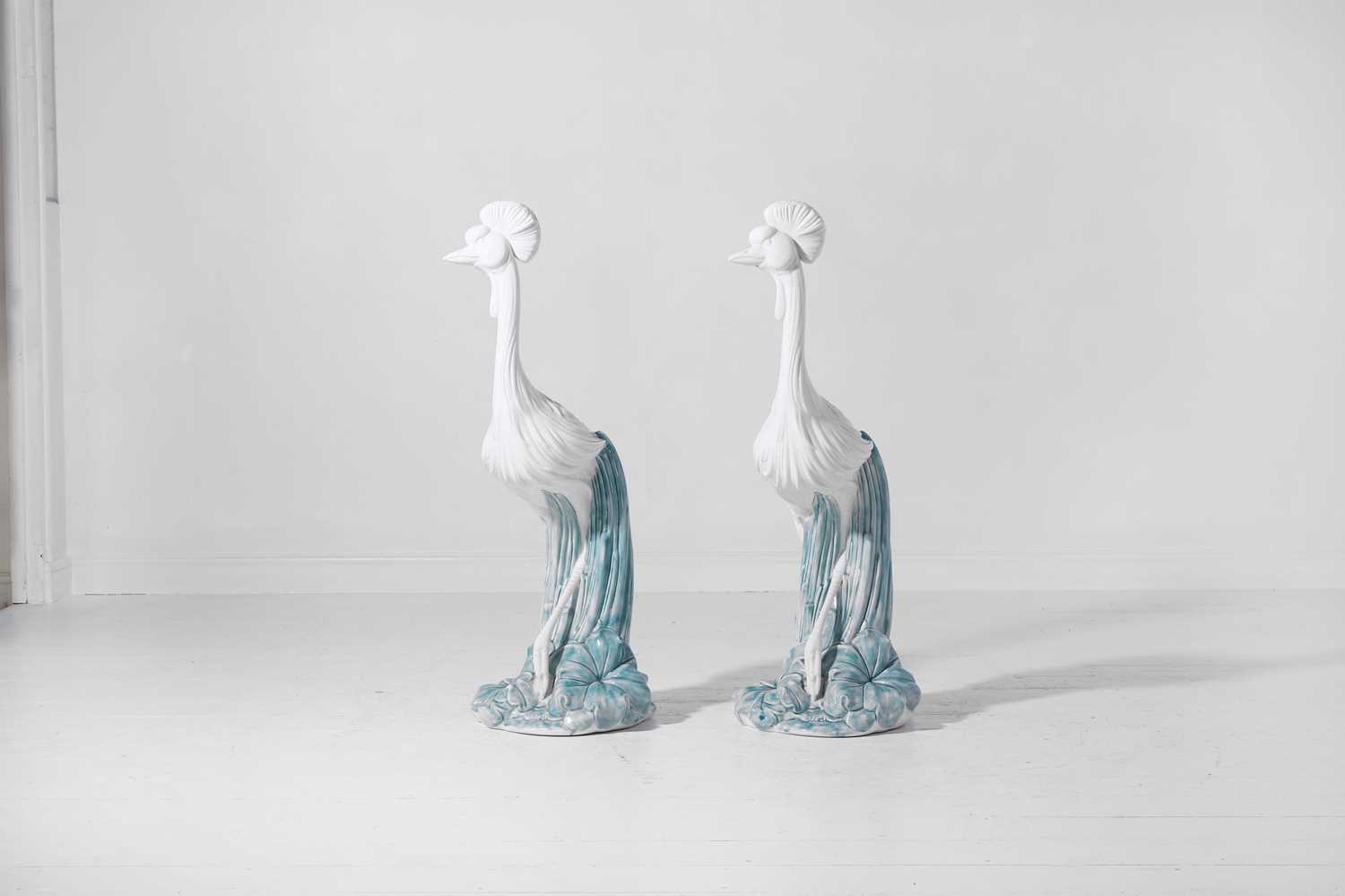 Lot 556 - A pair of glazed stoneware heron