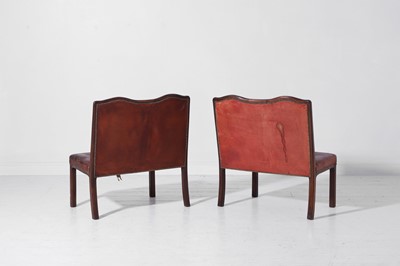 Lot 550 - A pair of walnut and leather hall benches
