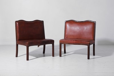 Lot 550 - A pair of walnut and leather hall benches