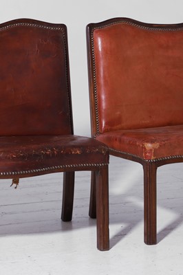 Lot 550 - A pair of walnut and leather hall benches