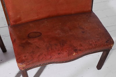 Lot 550 - A pair of walnut and leather hall benches