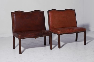 Lot 550 - A pair of walnut and leather hall benches