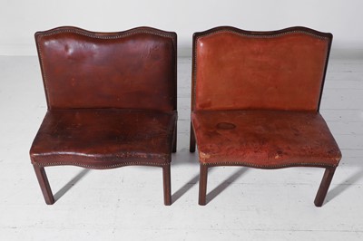 Lot 550 - A pair of walnut and leather hall benches