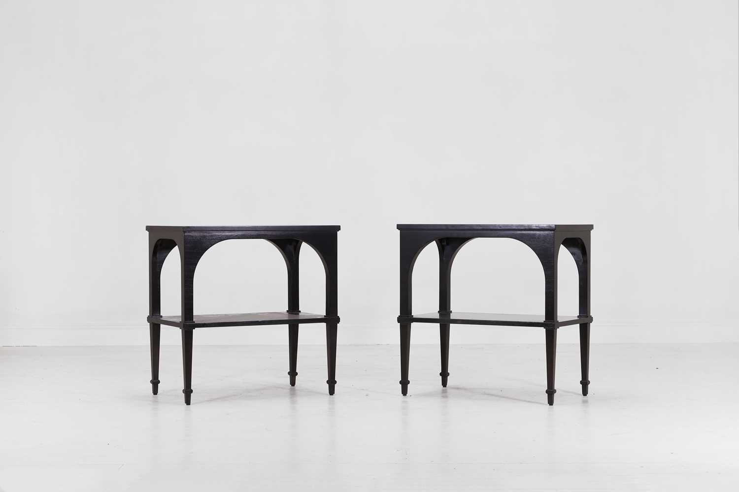 Lot 539 - A pair of ebonised wooden 'Primavera' side tables by Paolo Moschino