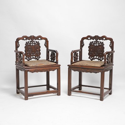 Lot 114 - A pair of Chinese hardwood armchairs