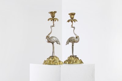 Lot A pair of ormolu and silvered candlesticks