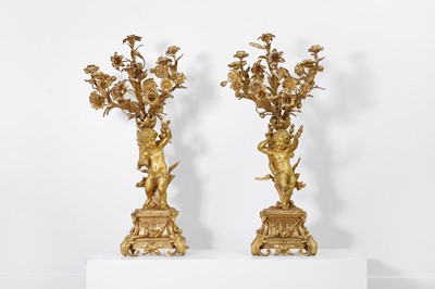 Lot 413 - A pair of Louis XVI style ormolu candelabra