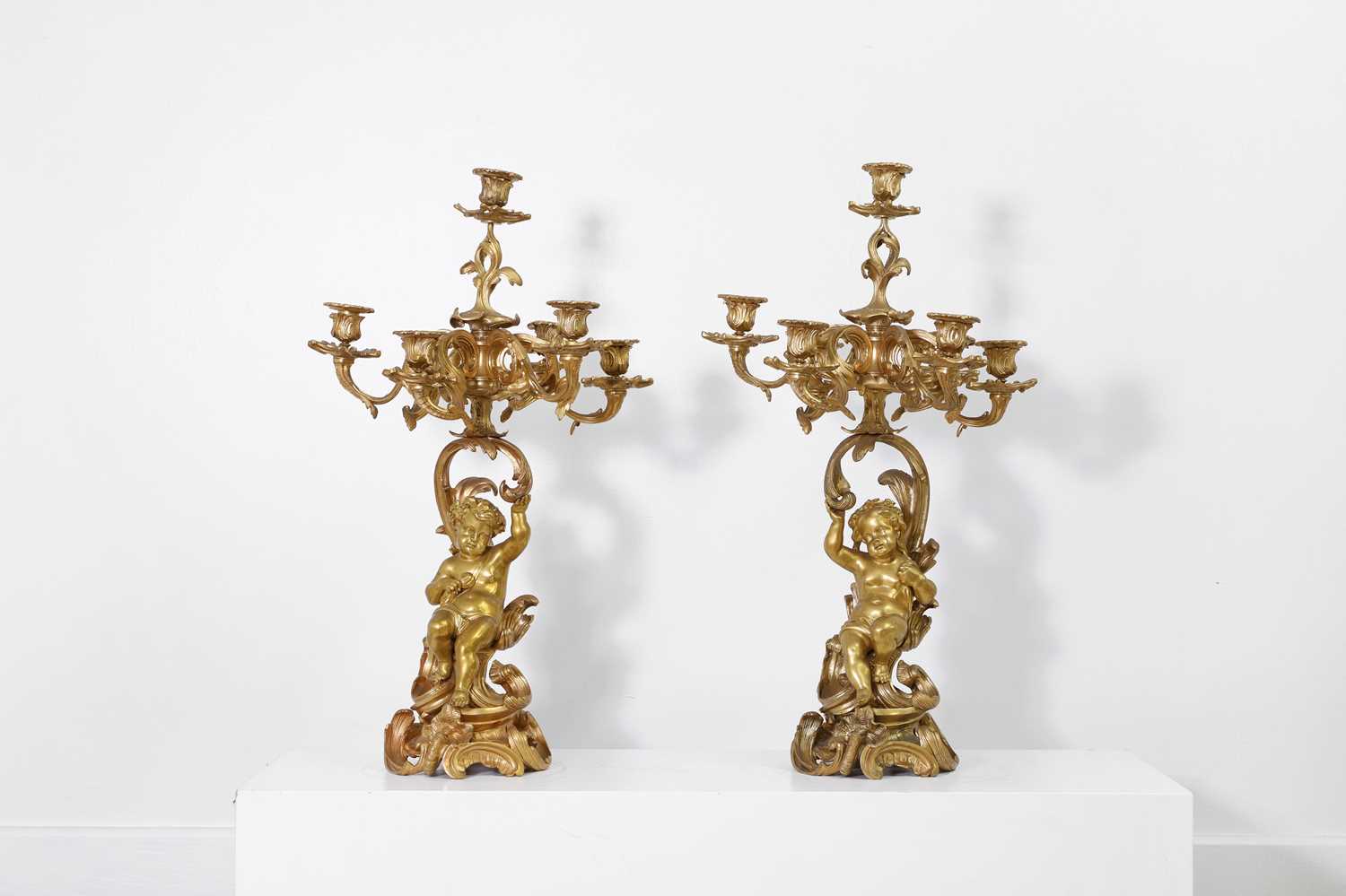 Lot 240 - A pair of Louis XVI-style ormolu candelabra