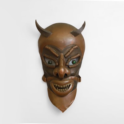 Lot 51 - A folk art devil mask