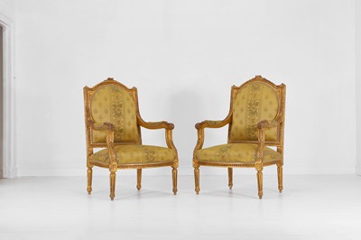 Lot 72 - A pair of Louis XVI-style carved giltwood fauteuils
