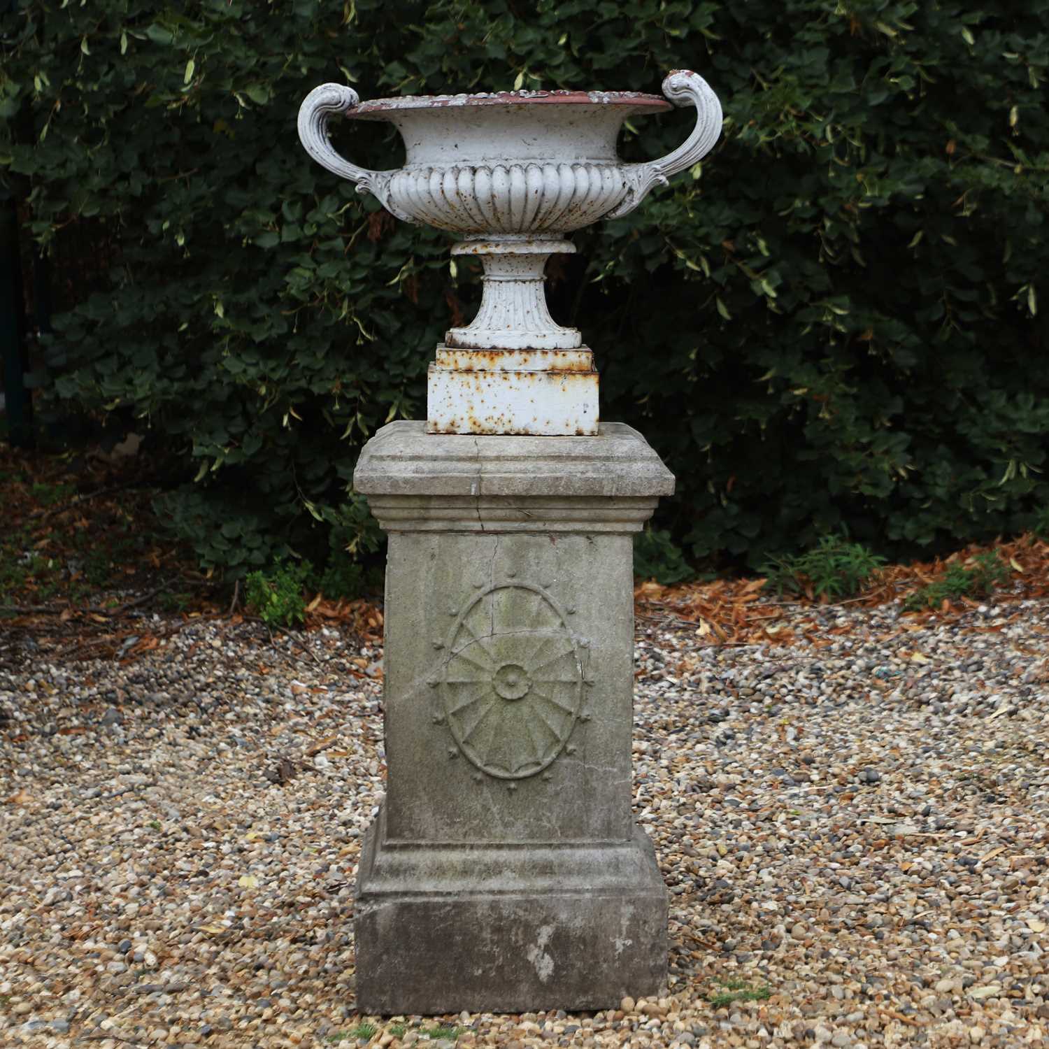 Lot 513 - A cast iron campana form urn