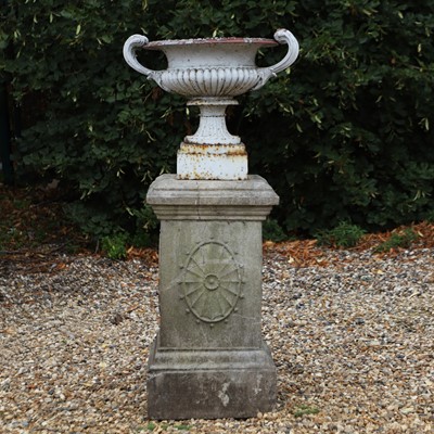 Lot 513 - A cast iron campana form urn