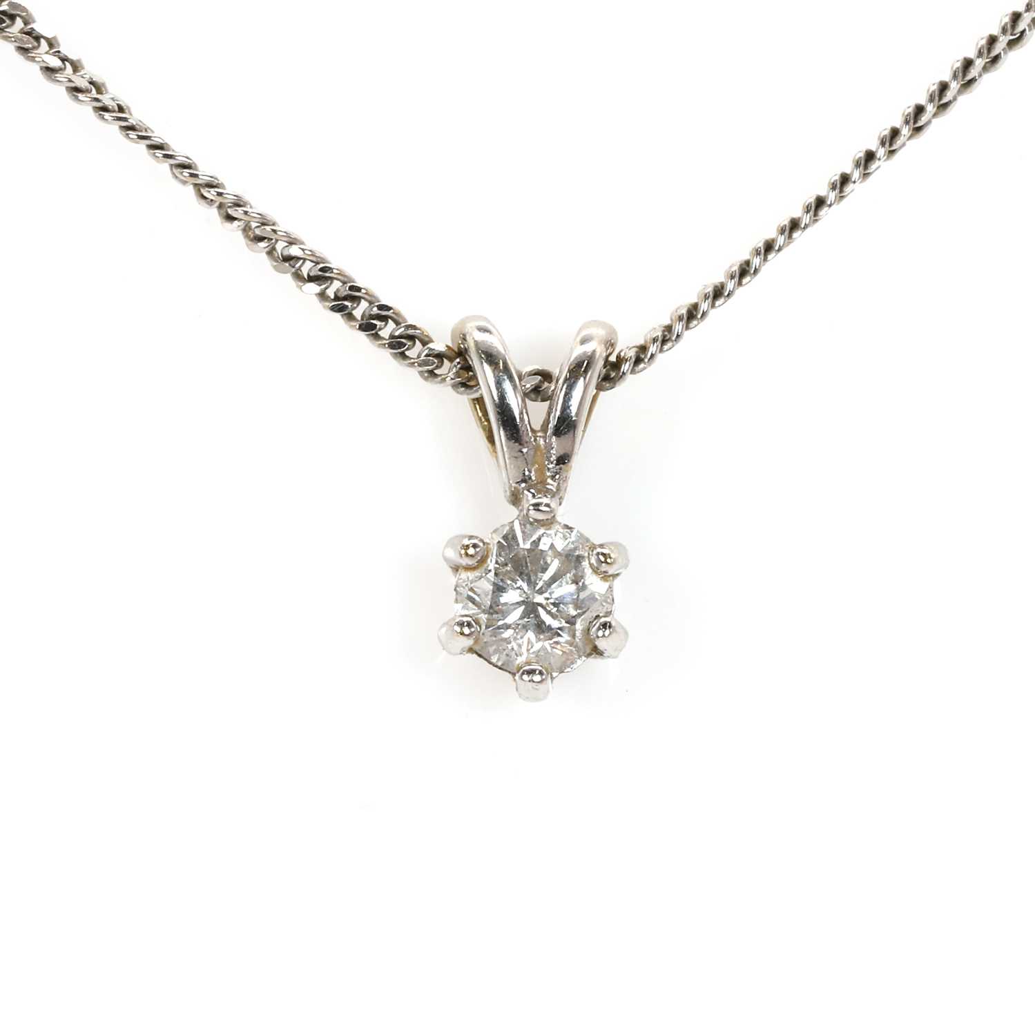 Lot 50 - An 18ct white gold diamond single stone pendant
