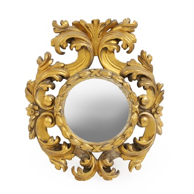 Lot 475 - A circular foliate gilt mirror