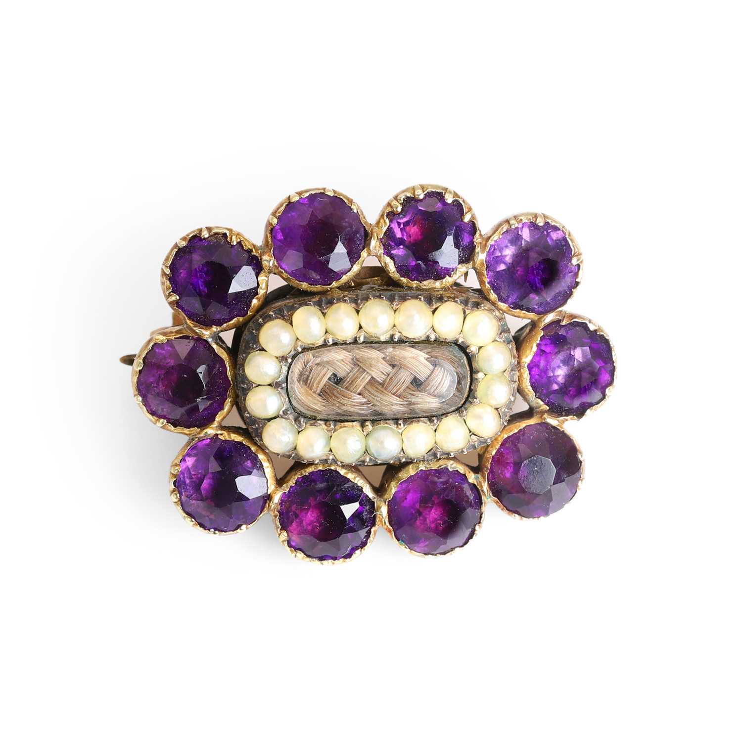 Lot 5 - A Georgian amethyst and split pearl mourning brooch