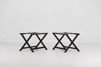 Lot 235 - A pair of ebonised wooden luggage stands