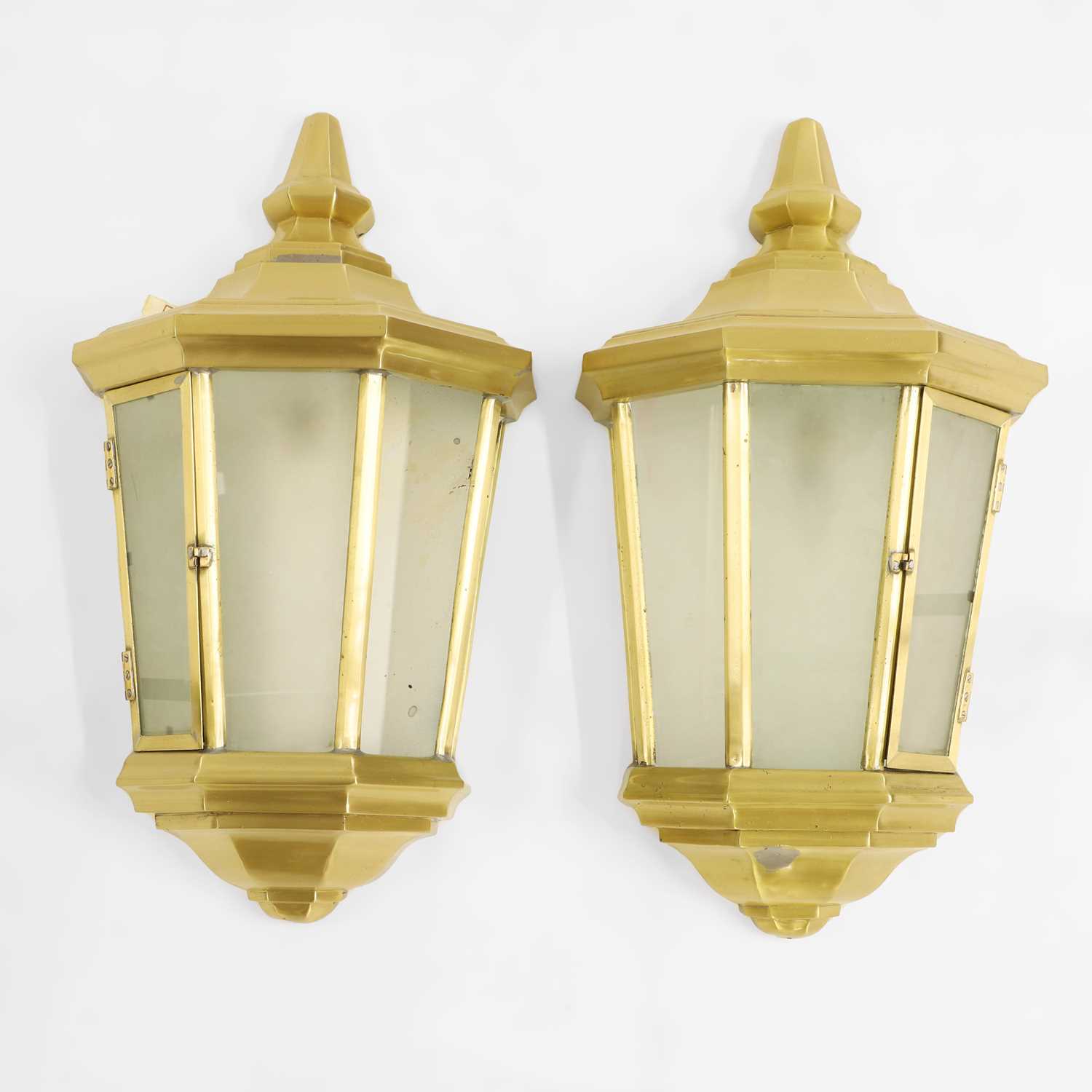 Lot 333 - A large pair of glazed gilt metal outdoor wall lanterns