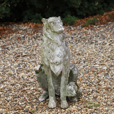 Lot 511 - A composite stone statue of a wolfhound