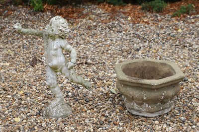 Lot 516 - A stone statue of a cherub with outstretched arm