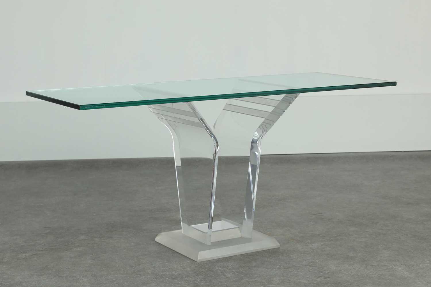 Lot 220 - A Lucite and glass console table