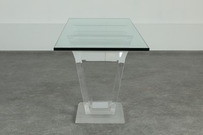 Lot 220 - A Lucite and glass console table