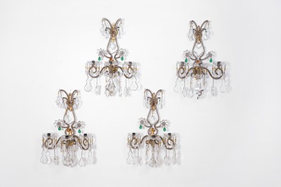 Lot 424 - A set of four crystal glass and gilt-metal wall lights
