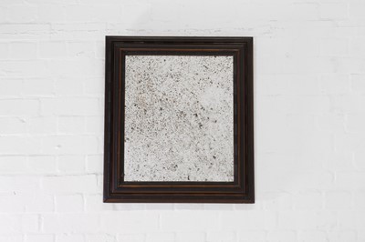 Lot 147 - A fruitwood and ebonised ripple-moulded mirror