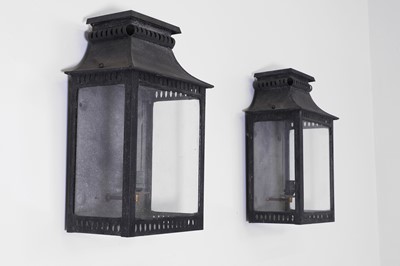 Lot 215 - A pair of zinc-patinated brass wall lanterns