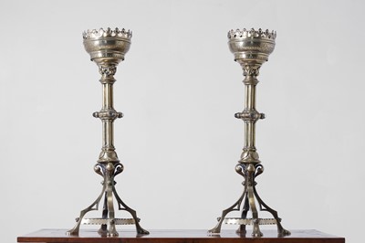 Lot 421 - A pair of Victorian Arts and Crafts brass altar candlesticks