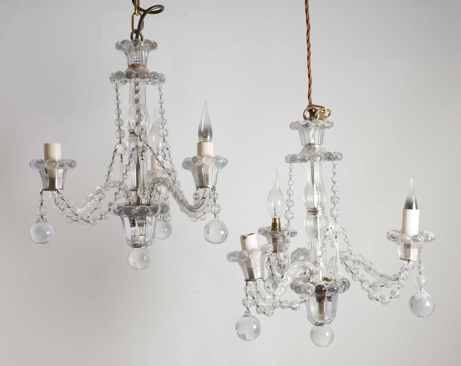 Lot 336 - A pair of cut glass chandeliers