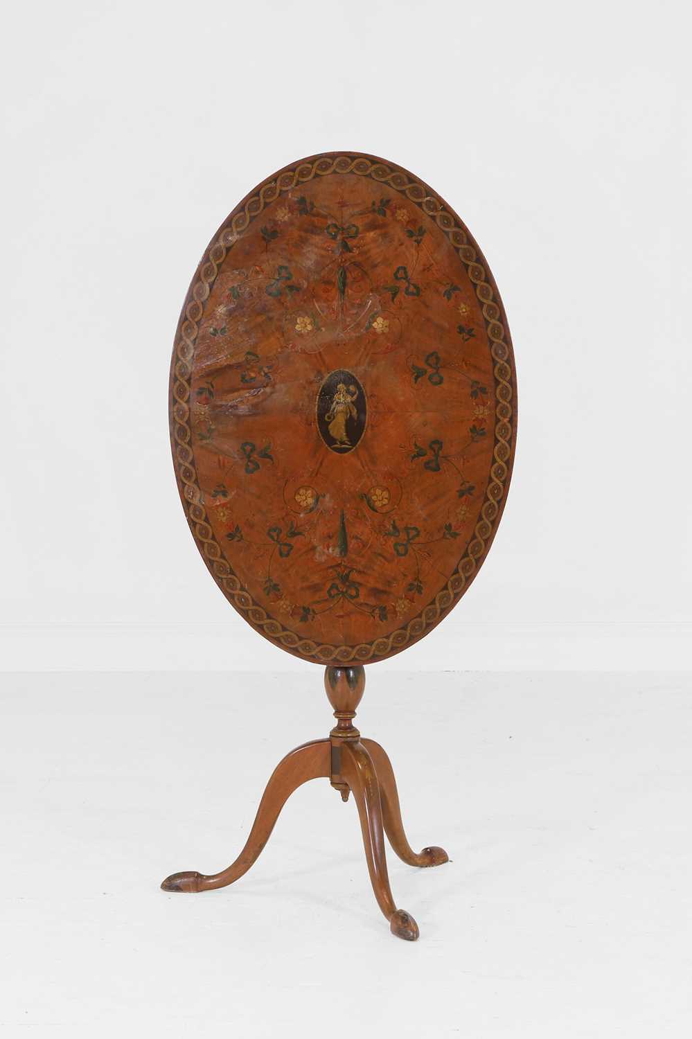 Lot 482 - A George III-style painted satinwood tripod table
