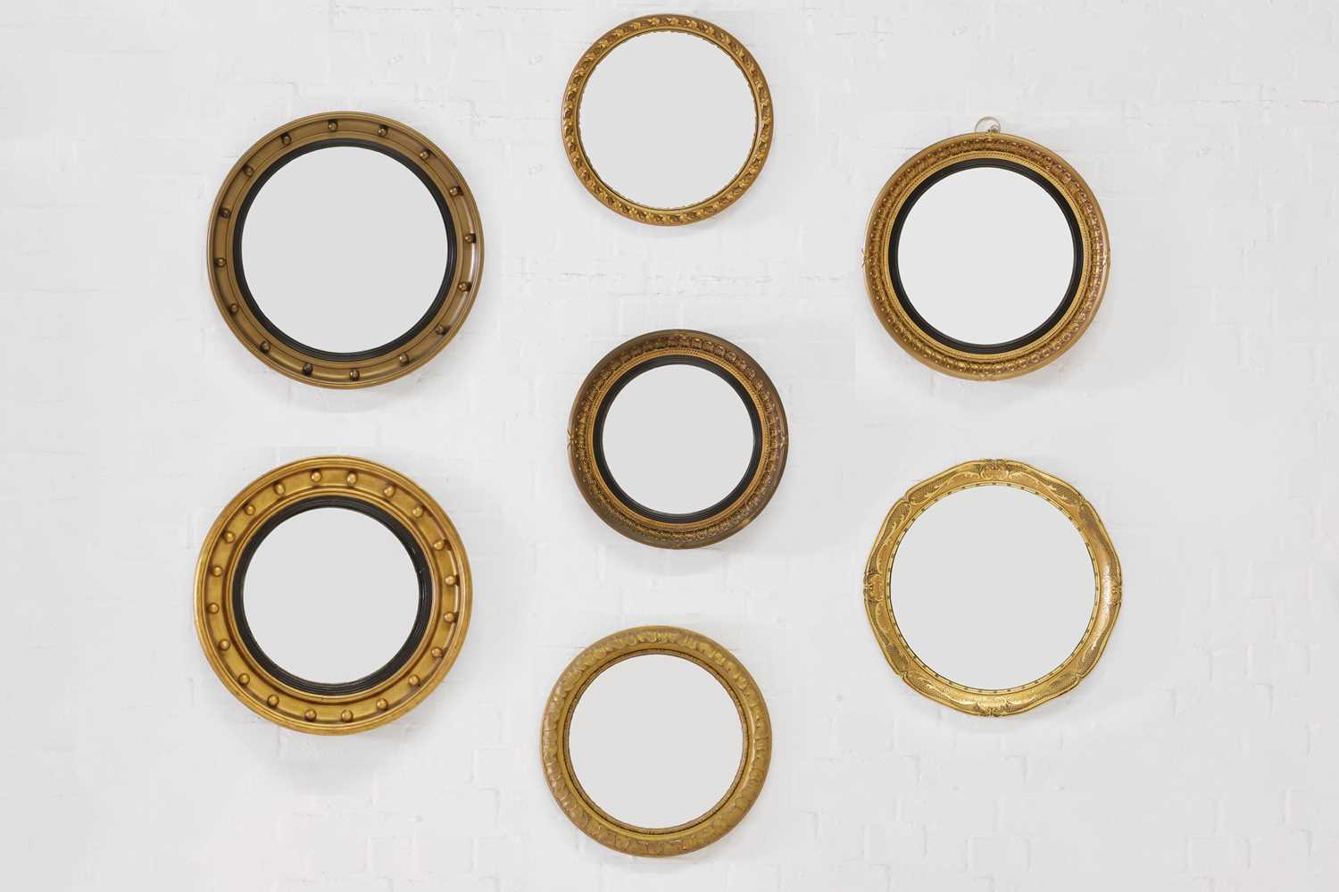 Lot 496 - A group of eight various giltwood convex