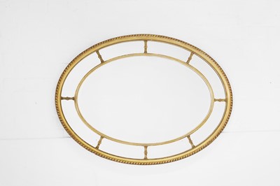 Lot 142 - A George III-style gilt and gesso oval mirror