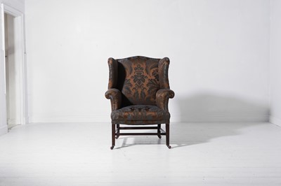 Lot 146 - A George III-style mahogany wing armchair