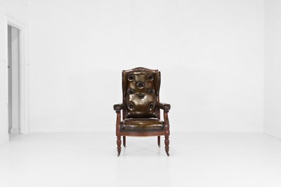 Lot 497 - A carved mahogany and leather library armchair