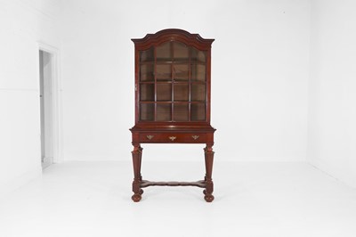 Lot 149 - A mahogany cabinet-on-stand in the Queen Anne taste
