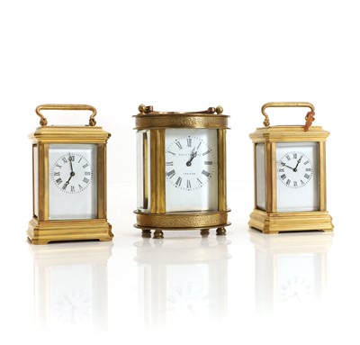 Lot 183 - Two miniature brass carriage timepieces