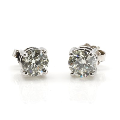 Lot 215 - A pair of diamond stud earrings