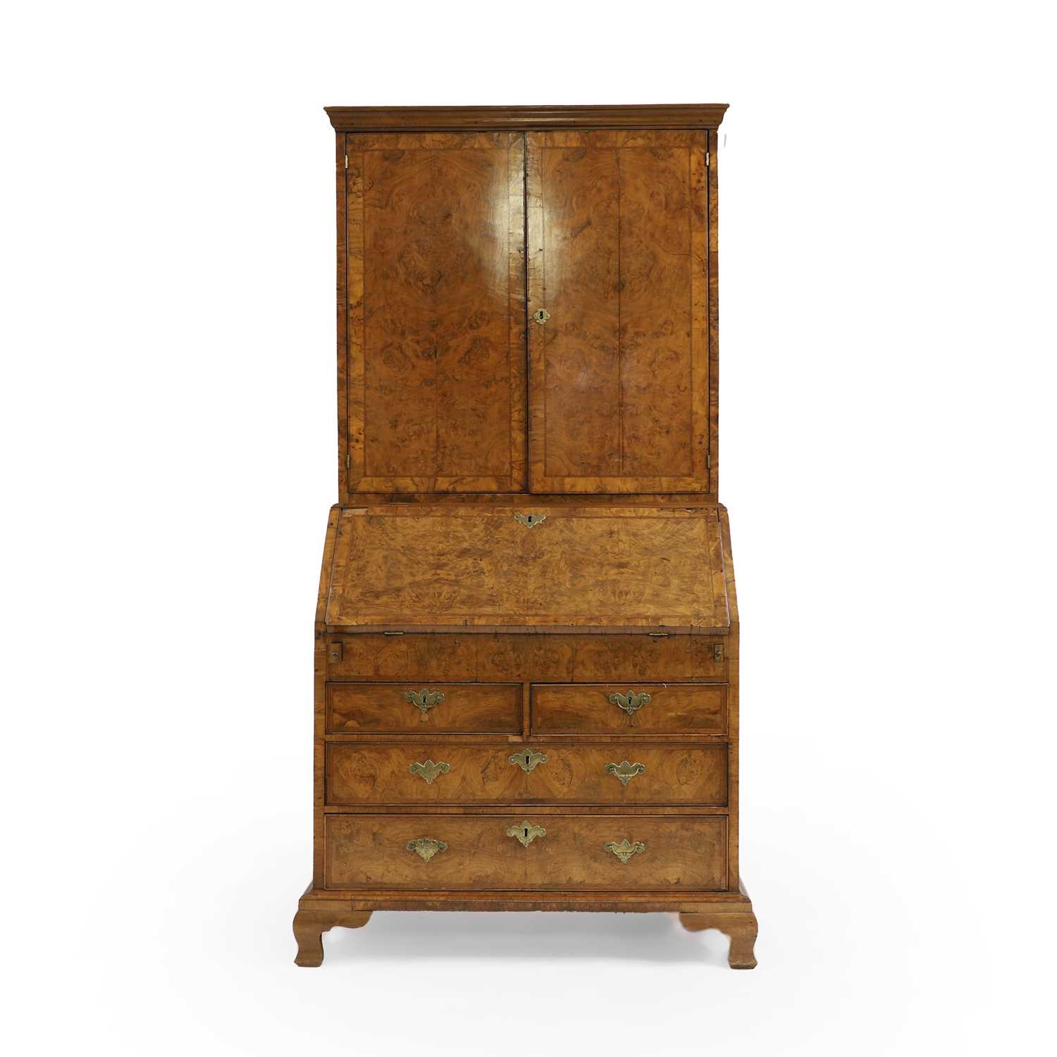 Lot 387 - A George I walnut bureau cabinet