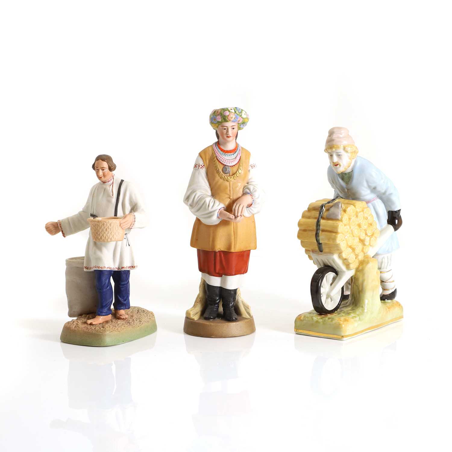 Lot 133 - A Dmitrov State Porcelain Factory bisque porcelain figure 'Sower' and a 'Flower Girl'