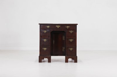Lot 484 - A small George II mahogany kneehole desk