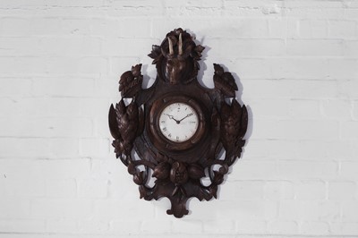 Lot 445 - A Black Forest carved oak wall clock